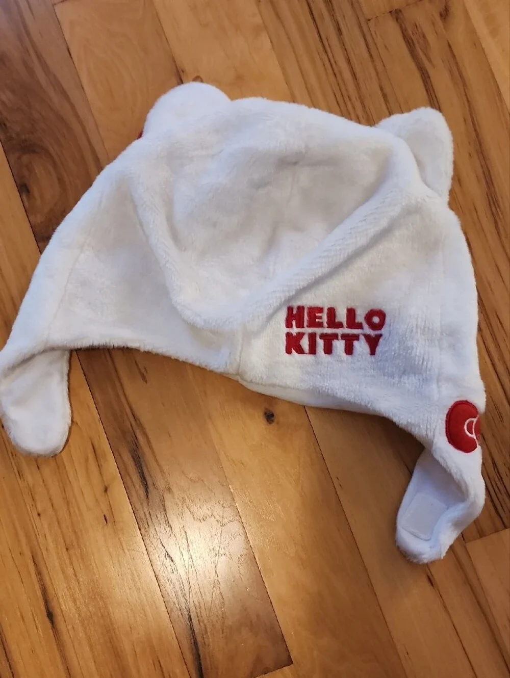 Hello Kitty White Plush Earflap Hat with Red Bow and Yellow Nose - Kids